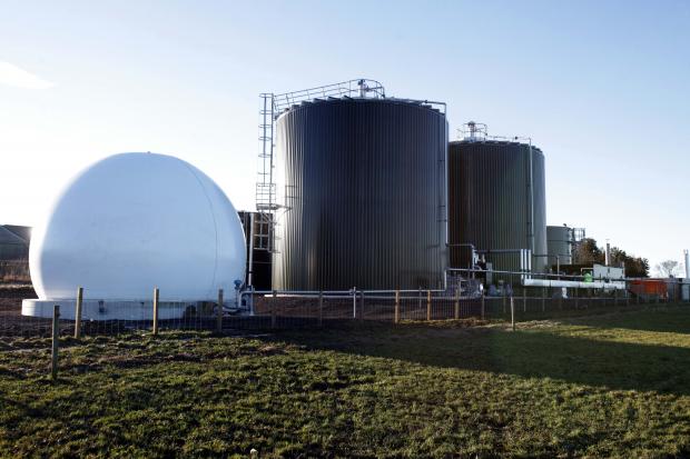 Photo 4 Anaerobic Digester’s with attached Methane Gas container