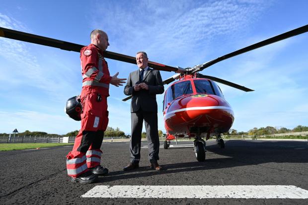 Minister Conor Murphy at a visit to Air Ambulance NI.