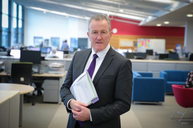 Finance Minister Conor Murphy in office environment