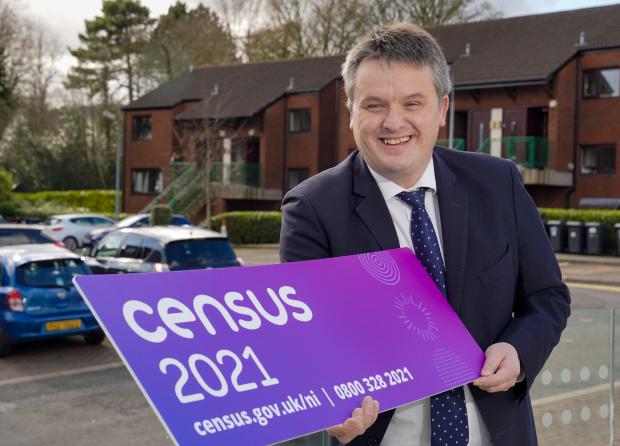 census director David Marshall holds a sign saying census 2021