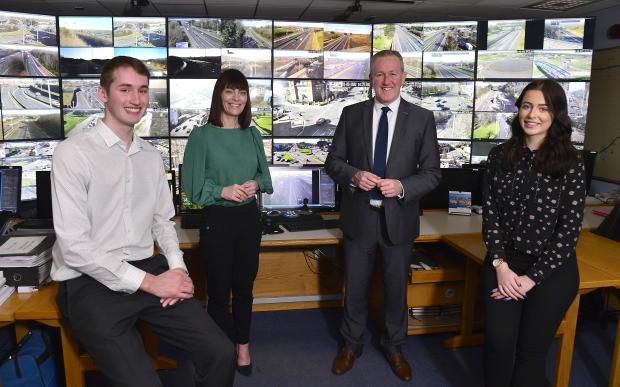 Ryan Gilbert DfI placement student with Infrastructure Minister Nichola Mallon Finance Minister Conor Murphy and DoF placement student Rebecca Wallace.