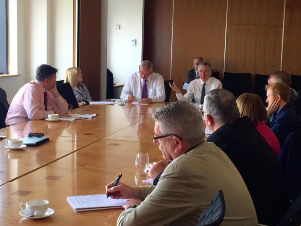 Finance Minister pictured as he met business, union and community leaders to discuss EU Referendum implications for the north